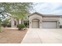 Beautiful two-story home with a three-car garage and desert landscaping at 2709 E Vista Dr, Phoenix, AZ 85032