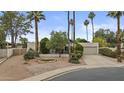 Street view of a beautiful home featuring mature landscaping and a well-manicured front yard at 2916 S Revere Cir, Mesa, AZ 85210