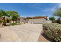 Charming home with well-manicured landscaping and spacious three car garage at 2994 E Mahogany Pl, Chandler, AZ 85249