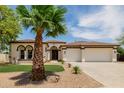 Charming home with well-manicured front yard, desert landscaping and spacious three car garage at 2994 E Mahogany Pl, Chandler, AZ 85249