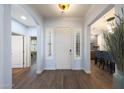 Inviting entryway with hardwood floors and a view into the adjacent dining and living areas at 3521 N Hooper St, Buckeye, AZ 85396