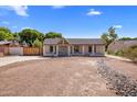 Inviting home with a well-maintained facade and low-maintenance landscaping at 439 N Cherry --, Mesa, AZ 85201