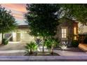 Charming stone home with manicured landscaping and warm exterior lighting at 4519 N 29Th Way, Phoenix, AZ 85016