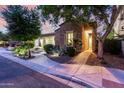 Charming stone home with manicured landscaping and warm exterior lighting at 4519 N 29Th Way, Phoenix, AZ 85016
