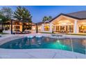 Backyard oasis with a pool, spa, and outdoor kitchen, perfect for entertaining at 5 E Oakwood Hills Dr, Chandler, AZ 85248