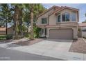 Charming two-story home featuring a two-car garage, desert landscaping, and a red tile roof at 533 N Cobblestone St, Gilbert, AZ 85234