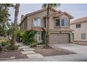Charming two-story home featuring a two-car garage, desert landscaping, and a red tile roof at 533 N Cobblestone St, Gilbert, AZ 85234