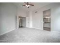 A serene bedroom with a ceiling fan and neutral tones ready for relaxation at 636 E Redondo Dr, Gilbert, AZ 85296