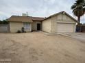 Single-story home with an attached garage and desert landscaping in a residential neighborhood at 6842 S 42Nd Pl, Phoenix, AZ 85042