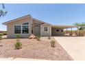 Charming home featuring a covered carport and desert landscaping for low maintenance appeal at 8500 E Southern Ave # 550, Mesa, AZ 85209
