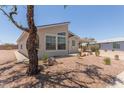 Well-maintained exterior view of property with a covered carport and desert landscaping at 8500 E Southern Ave # 550, Mesa, AZ 85209