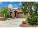 Beautiful single-story home showcasing desert landscaping and a convenient two-car garage at 9222 W Roma Ave, Phoenix, AZ 85037