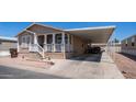 Charming home with covered parking, front porch, and well-maintained landscaping at 9431 E Coralbell Ave # 6, Mesa, AZ 85208