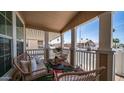 Comfortable front porch seating with stylish cushions and porch railing at 9431 E Coralbell Ave # 6, Mesa, AZ 85208