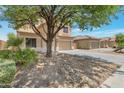 Beautiful two-story home with a two-car garage, long driveway, and xeriscaped yard for low maintenance at 9948 W Chipman Rd, Tolleson, AZ 85353