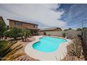 Relaxing backyard with sparkling pool and desert landscaping at 11563 W Jefferson St, Avondale, AZ 85323