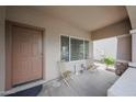 Welcoming front porch featuring neutral tones, seating and a place to enjoy the outdoors at 11563 W Jefferson St, Avondale, AZ 85323
