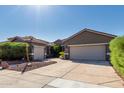 Beautiful home featuring a spacious driveway, desert landscaping, and a tile roof at 13629 W San Miguel Ave, Litchfield Park, AZ 85340