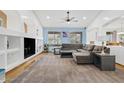Spacious living room with ample seating, large windows, and stylish decor at 13629 W San Miguel Ave, Litchfield Park, AZ 85340