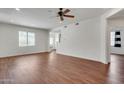 Open-concept living space featuring recessed lights and attractive wood flooring at 15252 N 100Th St # 1147, Scottsdale, AZ 85260