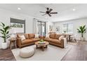 Bright living room featuring hardwood floors, recessed lighting, and comfortable sofas, perfect for relaxing and entertaining guests at 15252 N 100Th St # 1147, Scottsdale, AZ 85260