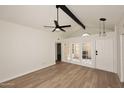 Bright living room featuring wood floors, vaulted ceilings, ceiling fan, and patio access at 15801 N 29Th N St # 20, Phoenix, AZ 85032