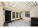 Covered patio with white trellis, textured walls, and modern lighting for outdoor enjoyment at 15801 N 29Th N St # 20, Phoenix, AZ 85032