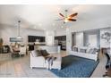 Open concept living space combining living, dining and kitchen areas with lots of natural light at 18577 W Coolidge St, Goodyear, AZ 85395