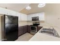 Efficient kitchen featuring modern appliances and ample counter space at 20428 N 32Nd Ln, Phoenix, AZ 85027