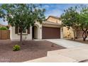 Charming single-story home with desert landscaping, decorative shutters and a two-car garage at 22040 N 119Th Dr, Sun City, AZ 85373