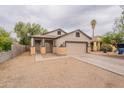 Charming single-Gathering home featuring a two-car garage and covered porch at 2210 N 27Th Pl, Phoenix, AZ 85008