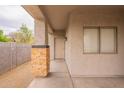 Covered porch with stone accents, offering a welcoming entrance to the home at 2210 N 27Th Pl, Phoenix, AZ 85008