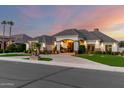 Beautiful home featuring manicured landscaping, a grand entrance, and tasteful exterior lighting at 23465 S 202Nd St, Queen Creek, AZ 85142