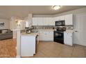 Well-lit kitchen featuring modern appliances, ample counter space, and stylish backsplash at 2366 E Spruce Dr, Chandler, AZ 85286