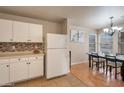 Bright kitchen and dining area with modern appliances and stylish backsplash at 2366 E Spruce Dr, Chandler, AZ 85286