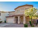 Exterior view of a stucco home with multiple windows and a front yard tree at 2652 E Riviera Dr, Chandler, AZ 85249