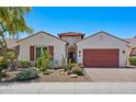 Beautiful single-story home showcasing terracotta tile roofing, desert landscaping, and a spacious garage at 30406 N 54Th St, Cave Creek, AZ 85331
