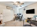 Comfortable bedroom with neutral walls, carpet flooring, ceiling fan, and a spacious closet at 4080 N 309Th Cir, Buckeye, AZ 85396
