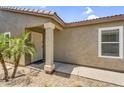 Inviting front porch with decorative security door, desert landscape, and a covered entry at 43787 W Colby Dr, Maricopa, AZ 85138
