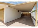 Attached car port featuring painted posts and covering at 510 N Entrada St, Chandler, AZ 85226