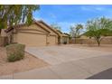 Charming single-story home featuring a three car garage and low-maintenance desert landscaping at 7019 S 19Th Pl, Phoenix, AZ 85042