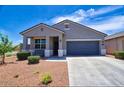 Beautiful single-story home with desert landscaping, covered porch, and neutral color scheme at 7751 W Miami St, Phoenix, AZ 85043