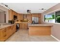 Modern kitchen with stainless steel appliances, sleek countertops, and ample cabinet space at 8140 E Mitchell Dr, Scottsdale, AZ 85251