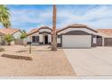 Charming single-story home with a well-maintained yard and a two car garage at 9231 W Grovers Ave, Peoria, AZ 85382