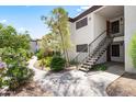 Well-maintained apartment building exterior with updated stairways and landscaping for a welcoming curb appeal at 9990 N Scottsdale Rd # 2029, Paradise Valley, AZ 85253
