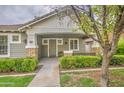 Charming home featuring a covered porch, well-kept lawn, and inviting curb appeal at 1143 S Annie Ln, Gilbert, AZ 85296