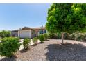 Charming single-story home with desert landscaping and a spacious driveway at 13614 N 33Rd Ave, Phoenix, AZ 85029