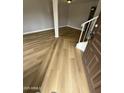 Welcoming foyer with wood-look flooring and a staircase, offering a modern aesthetic at 170 E Guadalupe Rd # 173, Gilbert, AZ 85234