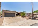 Single-story home with desert landscaping and attached garage at 1715 S Cholla St, Mesa, AZ 85202