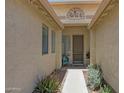 Charming home entryway with decorative metal art and cozy seating at 18550 W Mcneil St, Goodyear, AZ 85338